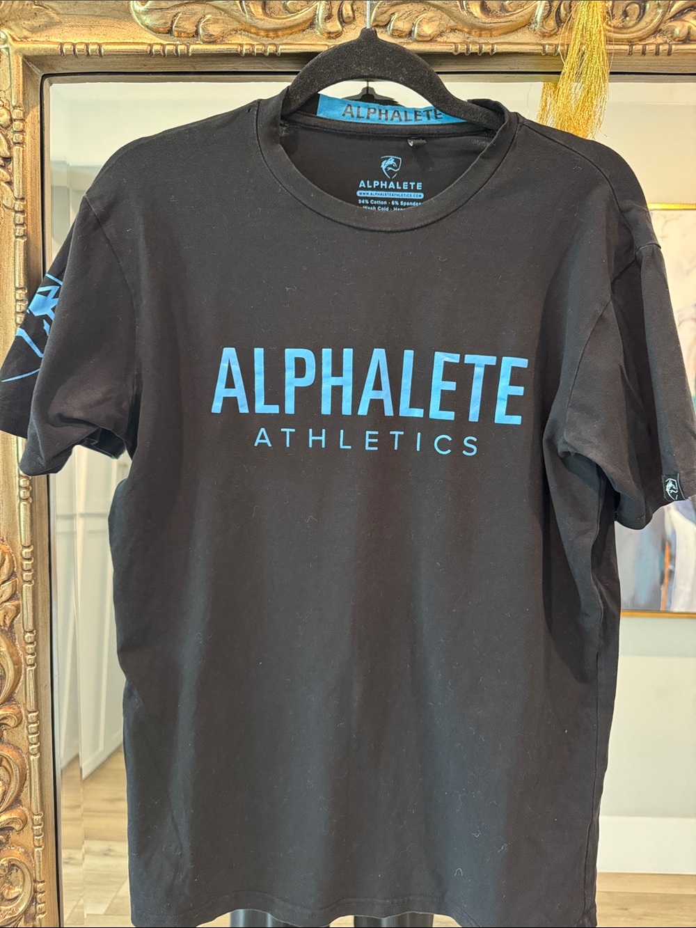 Alphalete Black Short Sleeve Tee with Light Blue Logo